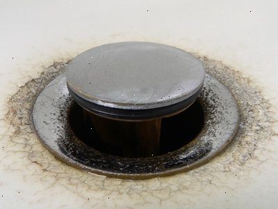 Hvordan å feste stroppen til horisontal stang i en vask